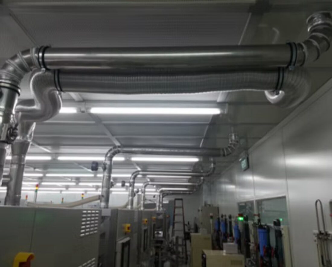 Insulated ductwork and pipe runs across a services plantroom ceiling.
